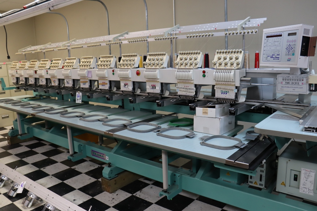 Item Image for Jym Bag Co. has decided to liquidate these assets in an online auction. Highlights to include: 2 Tajima TME-DC912 electronic 12 head 9 stitch embroidery machines, Riley Hopkin screen press, Black Body conveyor dryer, Impulse foot sealers