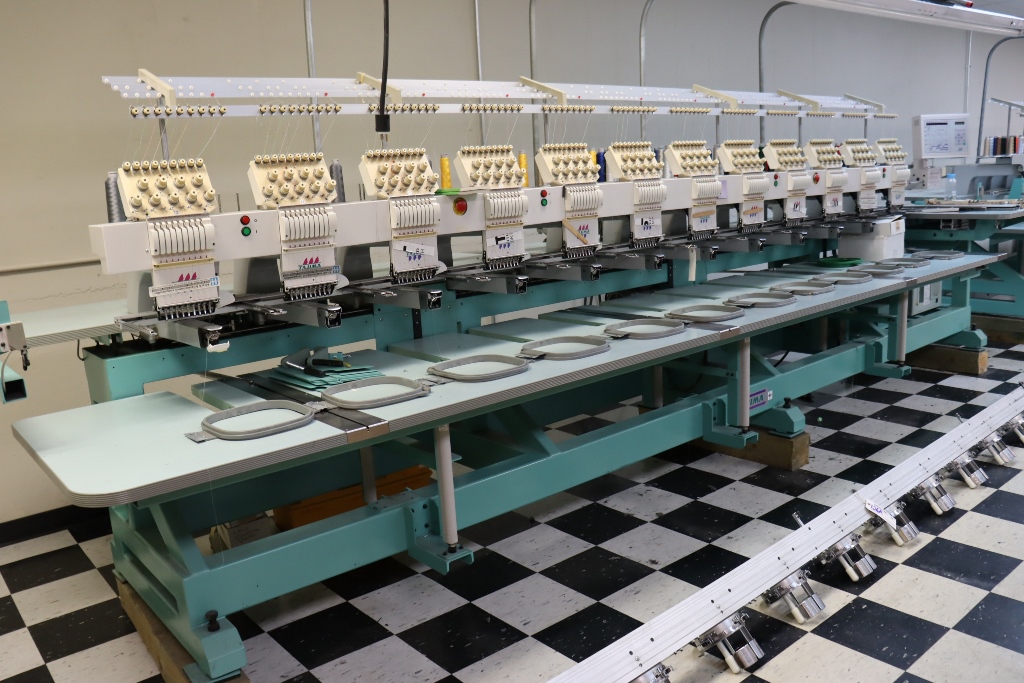 Item Image for Jym Bag Co. has decided to liquidate these assets in an online auction. Highlights to include: 2 Tajima TME-DC912 electronic 12 head 9 stitch embroidery machines, Riley Hopkin screen press, Black Body conveyor dryer, Impulse foot sealers